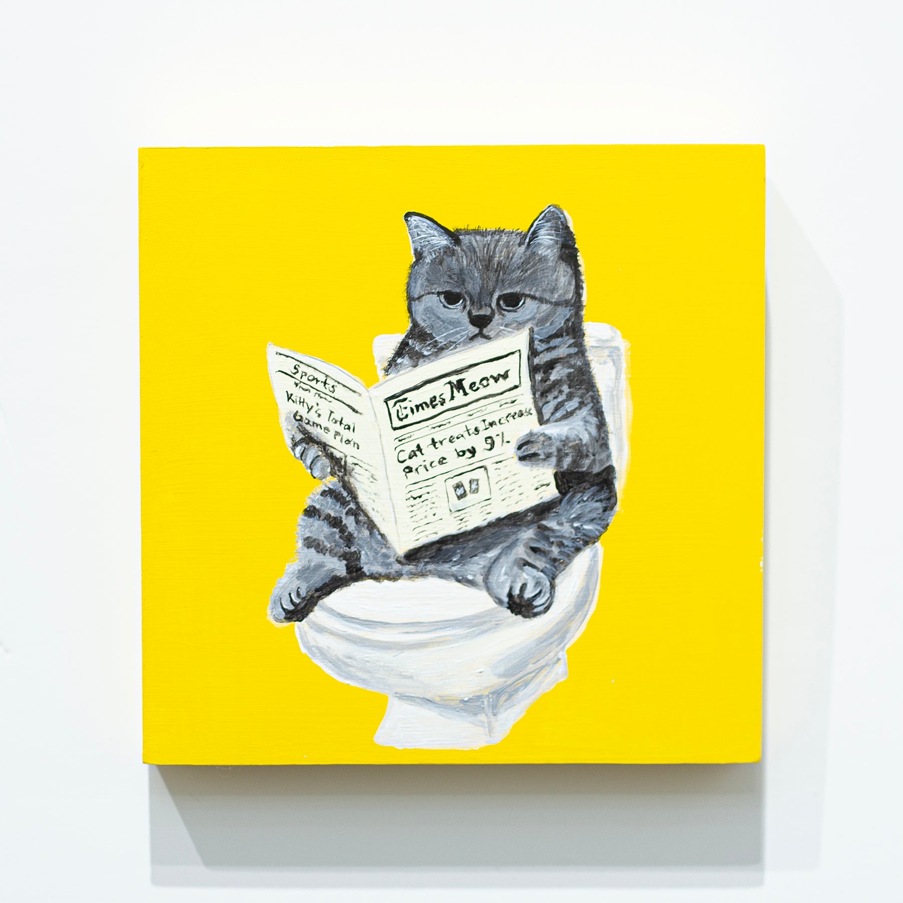 Cat Reading a Newspaper